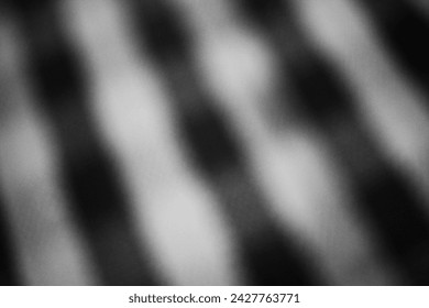 A blurry dreamy view of an alternating pattern in black and white.