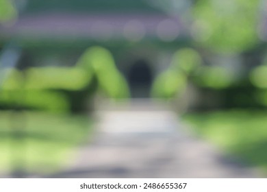 A blurry dreamy view of a sidewalk in the park. - Powered by Shutterstock