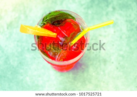 blurry effect on fresh cold red coral fruit watermelon strawberry mojito cocktail with mint