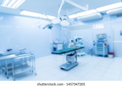 Blurry empty interior operating room and modern equipment in hospital.Medical device for surgeon surgical emergency patient in blue tone style.Save life medical treatment concept.