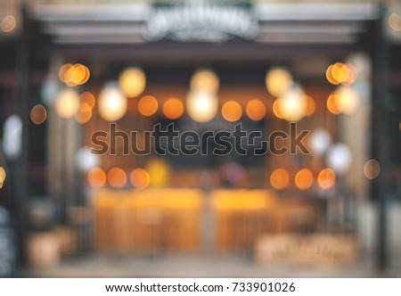 Blurry facade with garlands. Festive blurry background. Natural bokeh.