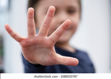 Blurry Face Of Little Boy Showing Five Fingers At Camera,Selective Focus Of Kid Primary School Counting Number Five,Cute Kid Showing Five Numbers With Fingers, Education Or Toddler Development Concept