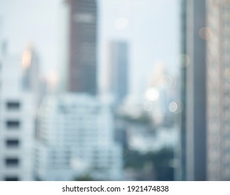 Blurry Focus City Hotel Corporate Building In Blue Morning Business Background. Cityscape Skyline Light Outside Office Window Grey Sky View. Day Bokeh Winter Bank Company Blur Backdrop Outdoor.