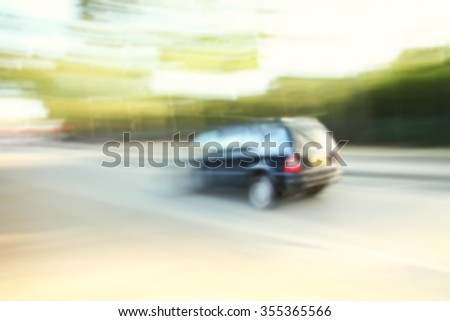 The blurry focus scene of car moving on road represent the vehicle and transportation concept related idea.