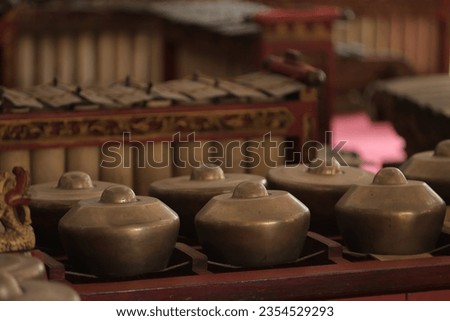 blurry, Gamelan is a traditional Javanese, Sundanese and Balinese music ensemble in Indonesia which has a pentatonic scale in the slendro and pelog scale systems.