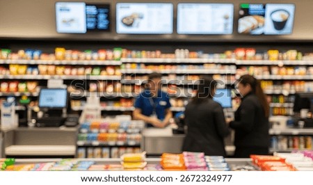 Blurry image of a convenience store interior with customers at the checkout counter and shelves stocked with various products.
