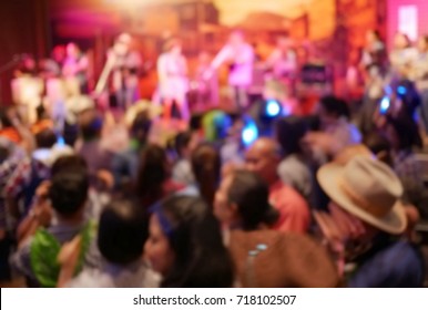 Blurry image in cowboy night party concert.