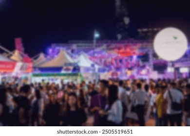 Blurry image of a crowded night market in Hong Kong, China, with bokeh lights in the background. - Powered by Shutterstock