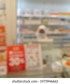 Blurry Image Of Hijab Female Cashier Wearing Medical Mask While Working In Convenience Store During Pandemic Covid-19 Or Coronavirus.