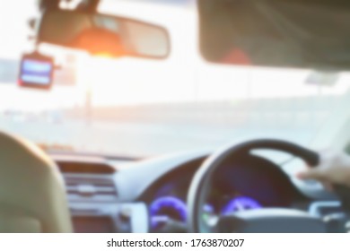 Blurry image interior vision perspective of the car drive by brand new driver at expressway on twilight summer season for safety insurance business background.