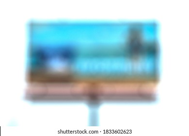 Blurry Image Of A Large Billboard On A Light Background