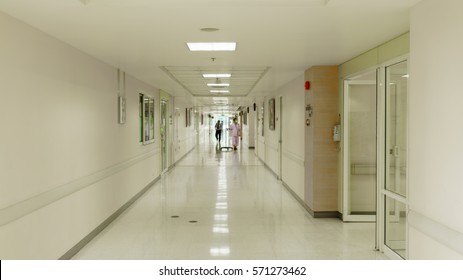 Blurry image of patient walking in hospital corridor