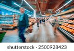 Blurry image of a supermarket aisle with shoppers moving quickly, creating a dynamic and busy atmosphere, ideal for retail or consumerism themes.