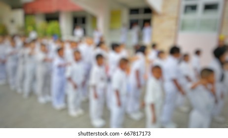 Blurry images of students in row - Shutterstock ID 667817173