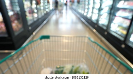 Blurry Images Of Supermarket Cart In Big Shopping Department Stores And POV Or Subjective Camera Angle.