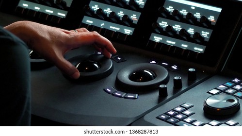 Blurry Images Of Telecine Controller Machine Transferring Motion Picture Film Into Video And Editing Or Adjusting In A Color Suite Studio Lab. Which Used In The Movie Post-production Process 