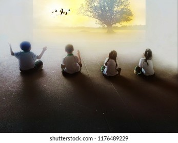 blurry image,The children were surrounded by a good atmosphere. In the study of environmental resources. Birds fly through the sun. The tree  planted as a symbol of education. To succeed in the future - Powered by Shutterstock