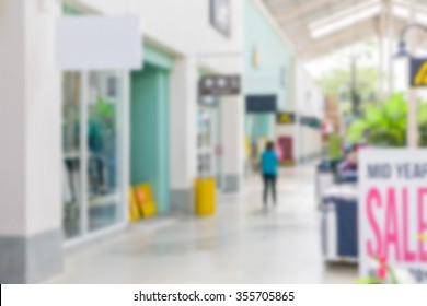 Blurry Indoor Outlet Shopping Mall Store. 