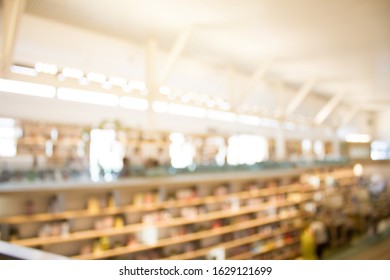 Blurry  Library Background And Co-working Space. Library Resources Book Shelves