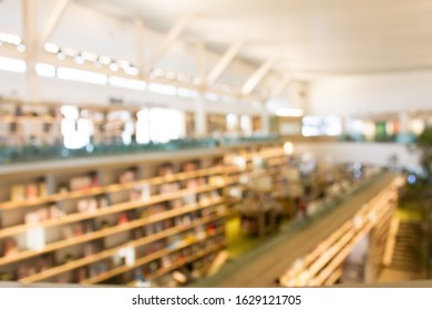 Blurry  Library Background And Co-working Space. Library Resources Book Shelves