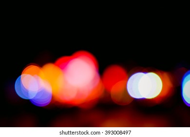 Blurry light effect from small size of multicolor lightbulb on dark background represent the abstract concept related idea.