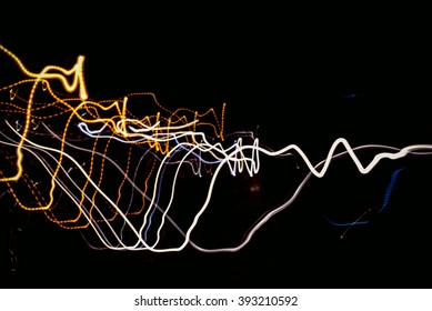 Blurry light effect from small size of multicolor lightbulb on dark background represent the abstract concept related idea.