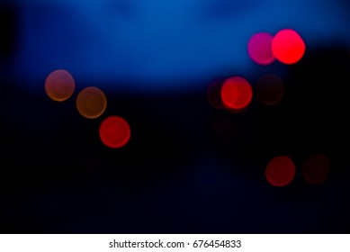 Blurry light effect from small size of multicolor lightbulb on dark background represent the abstract concept related idea.
