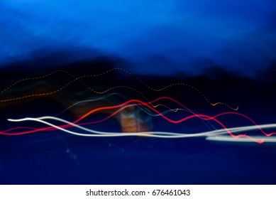 Blurry light effect from small size of multicolor lightbulb on dark background represent the abstract concept related idea.
