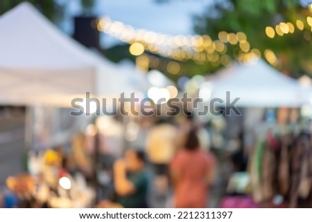 The blurry Market fair environment around shopping community and market place located in Asia.