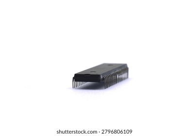 A blurry microcontroller on a white background. An archaic concept of technological advancement.