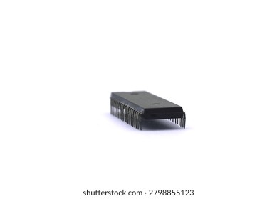 A blurry microcontroller on a white background. An archaic concept of technological advancement.