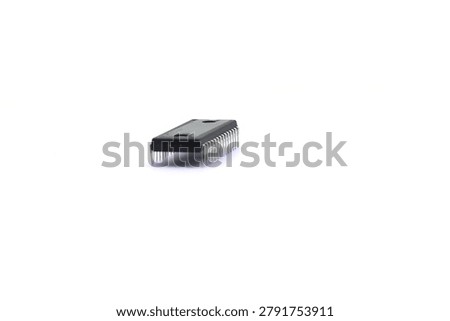 A blurry microcontroller on a white background. An archaic concept of technological advancement.