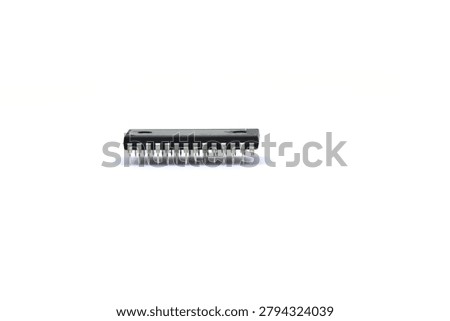 A blurry microcontroller on a white background. An archaic concept of technological advancement.