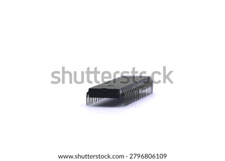 A blurry microcontroller on a white background. An archaic concept of technological advancement.