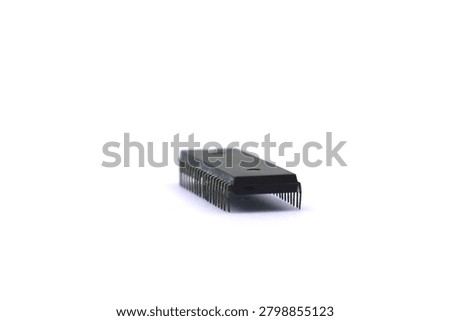 A blurry microcontroller on a white background. An archaic concept of technological advancement.