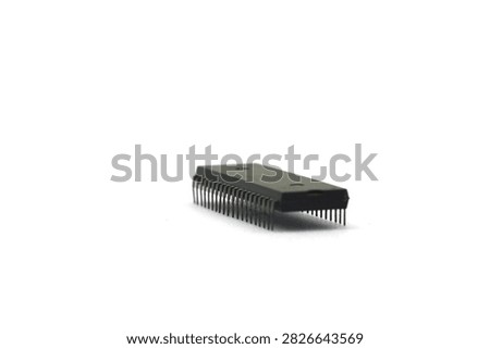 A blurry microcontroller on a white background. An archaic concept of technological advancement.