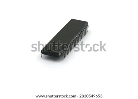 A blurry microcontroller on a white background. An archaic concept of technological advancement.
