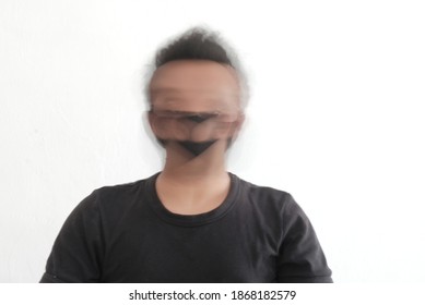 Blurry Movement Of Man In White Background, Blurred Face Of Man Wearing Black T Shirt, Slow Shutter Speed Portrait