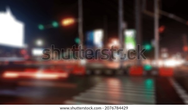 Blurry night\
street. reflections on the\
road