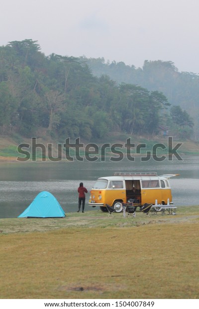 Blurry and Noise. Waduk Sermo, KulonProgo,\
Yogyakarta, Indonesia, 31 August 2019; Camping on the edge of the\
lake with a favorite car