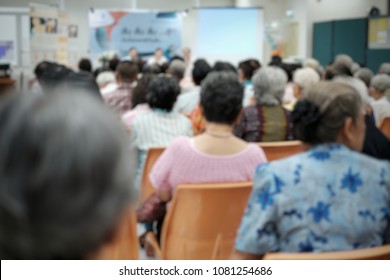 Blurry Old People In The Seminar Event. Many Elderly In The Conference Room. Concept Of Seniors Seminar , Health Care And Medical