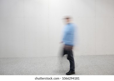 Blurry Person Walking In The Airport