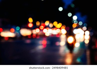 A blurry photo of a city street at night with lights from cars and motorcycles. Scene is busy and chaotic, with the lights from the vehicles creating a sense of movement and energy - Powered by Shutterstock