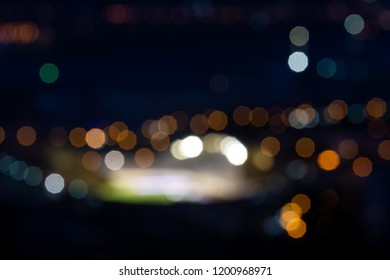 Blurry Picture Of A Football Stadium At Night, With Lots Of Bokeh And Blown Out Lights