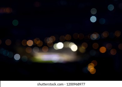 Blurry Picture Of A Football Stadium At Night, With Lots Of Bokeh And Blown Out Lights