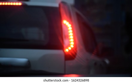 Blurry Red Brake Lights Of A Car Unique Photo