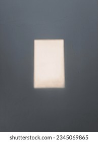 Blurry Reflection On The Wall From The Windowpane.