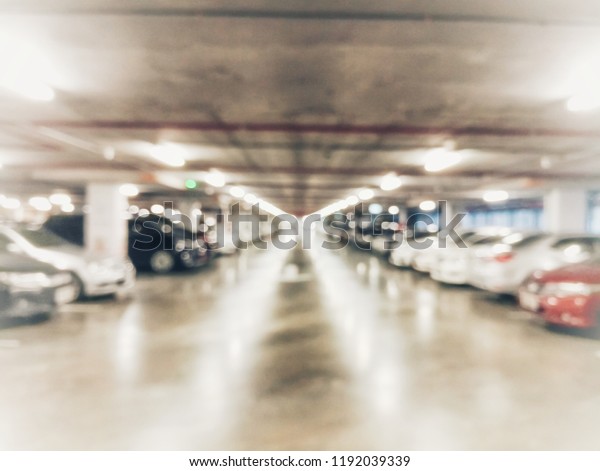 Blurry Scene of indoor parking area as abstract\
background - Retro style soft\
tone