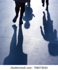 Blurry Shadows Of Mother With Two Kids Running After Her In The Night