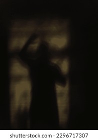 a blurry silhouette of a man. Shadow on the wall. A terrible picture. imitation of the movie. noise and distortion in the photo.